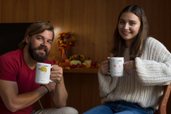 Picture of a couple each holding empowerment mugs with the affirmation I can and I will